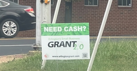 Billboard with text 'Need cash? Arlington's small business grant 2.)'