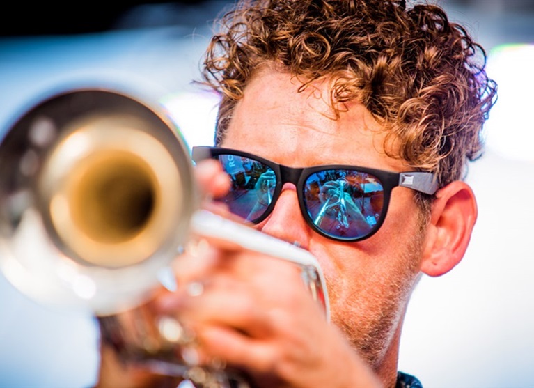 Jazz musician playing a trumpet